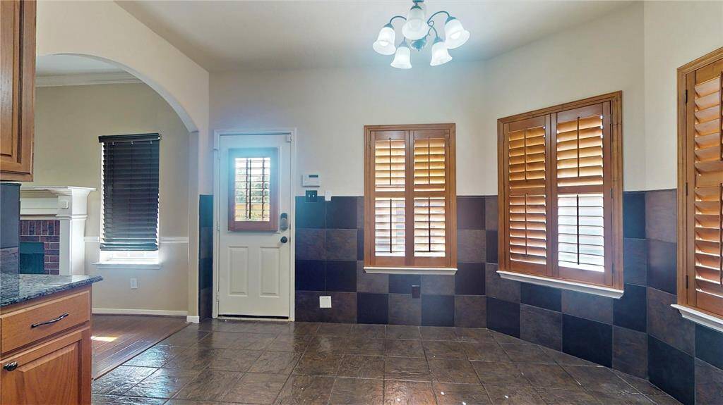 Elegant gourmet kitchen with cozy dining nook.