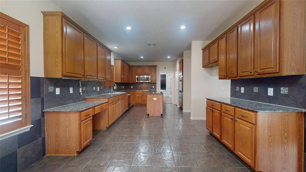 Chef's dream kitchen with sleek design and ample counter space.