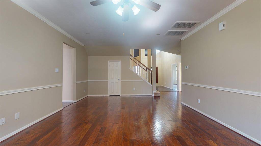 Spacious family room with convenient under-stair storage.