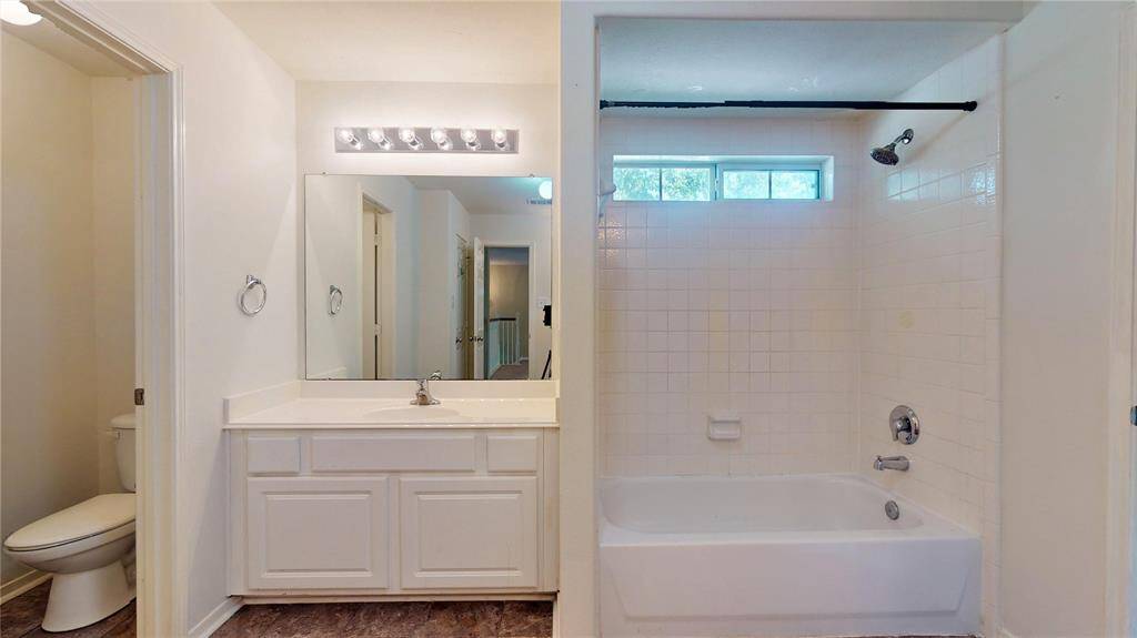Spacious second full bathroom upstairs, perfect for guests.