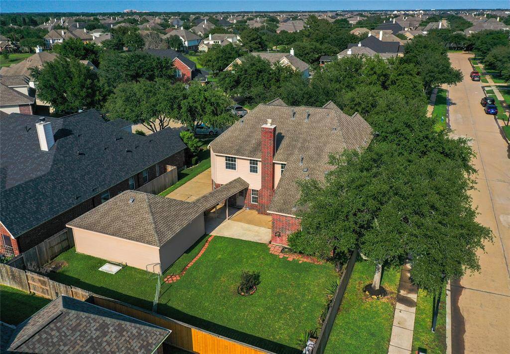 Discover a spacious backyard oasis, perfect for relaxation and outdoor gatherings.