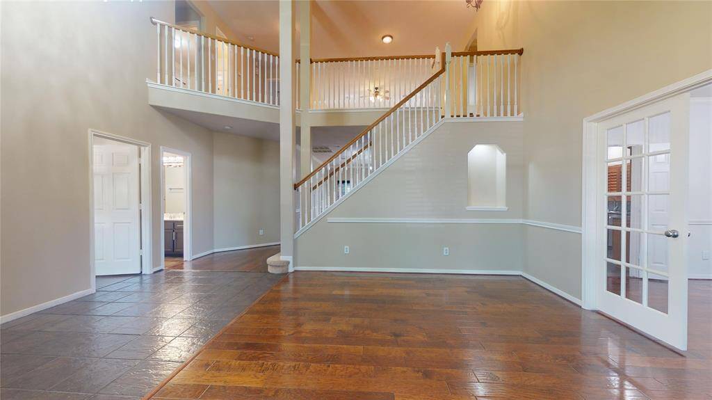 Inviting family room with elegant double doors opening to the dining area.