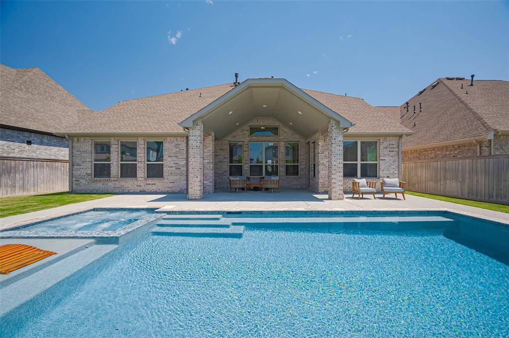 The Backyard features a spacious Rectangular shaped in-ground pool with water feature, spa, and tanning ledge.  The Extended Covered Patio overlooks your backyard oasis and neatly landscaped lawn.
