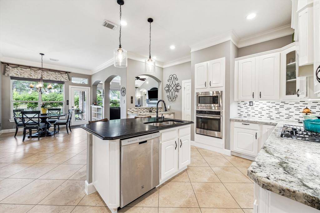 Expansive kitchen with honed granite island