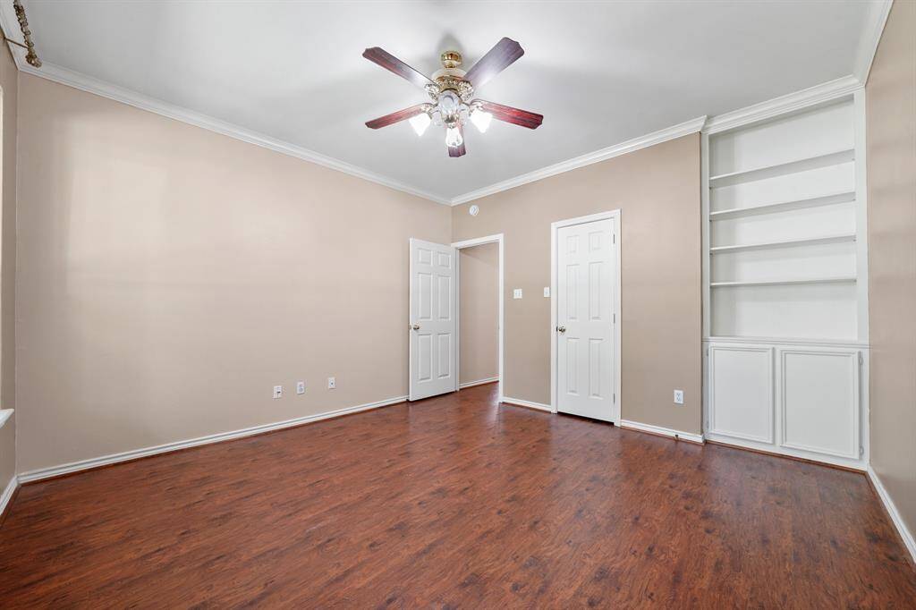 Guest bedroom 1 with built in shelves/cabinets