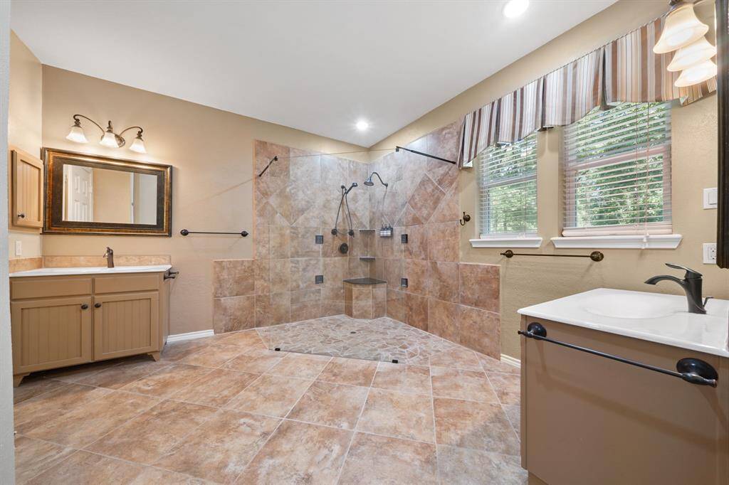 Incredible bathroom with a walk through shower and dual sinks