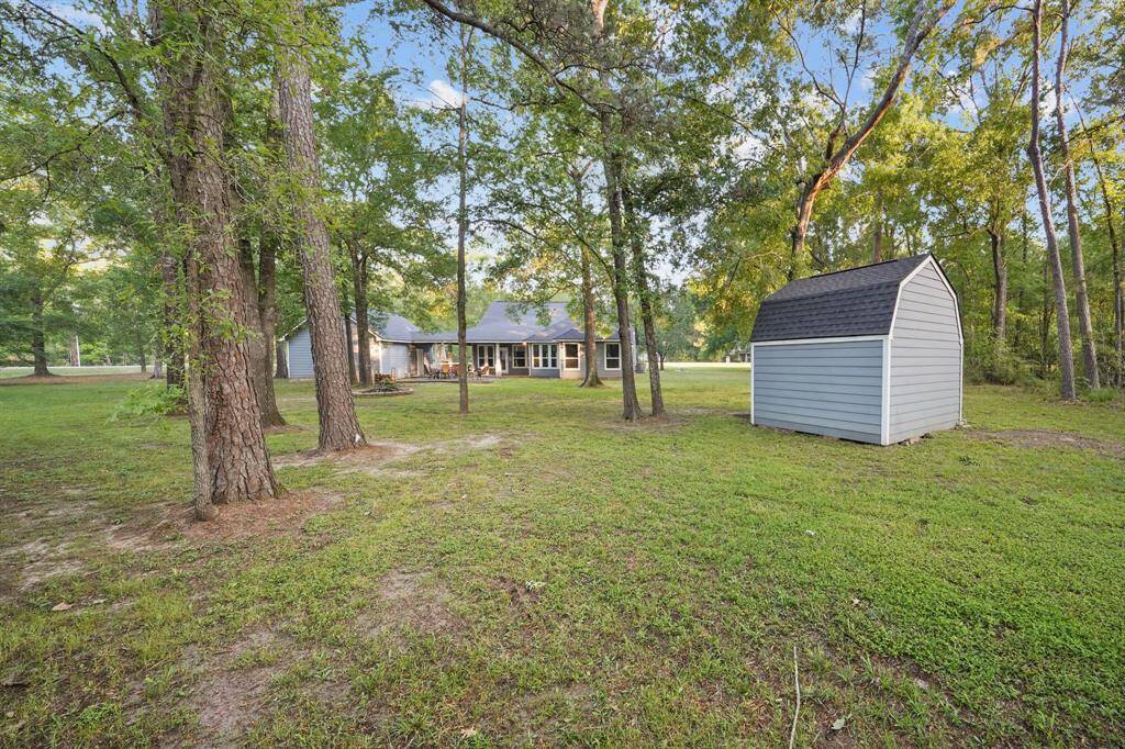 View of the back of the home next to the storage shed