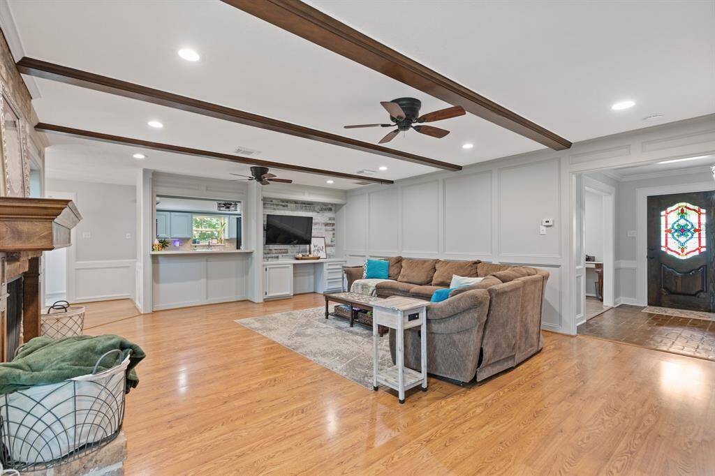 Freshly painted and wood look floors help make the room have a modern feel.