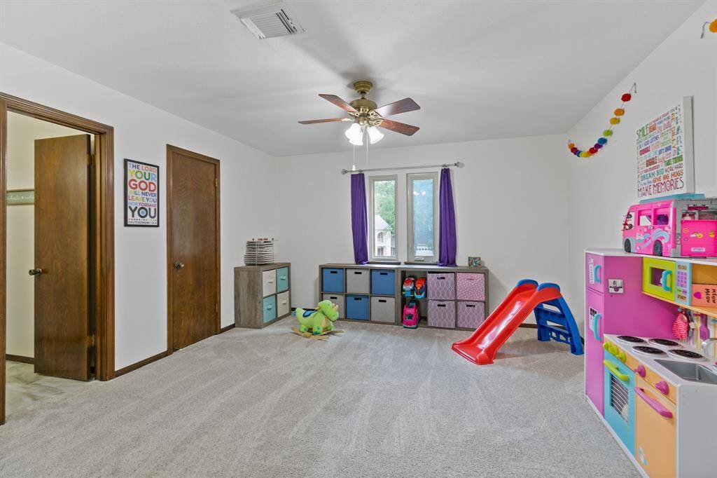 Game room with bathroom access and a large closet to store games, toys and more!