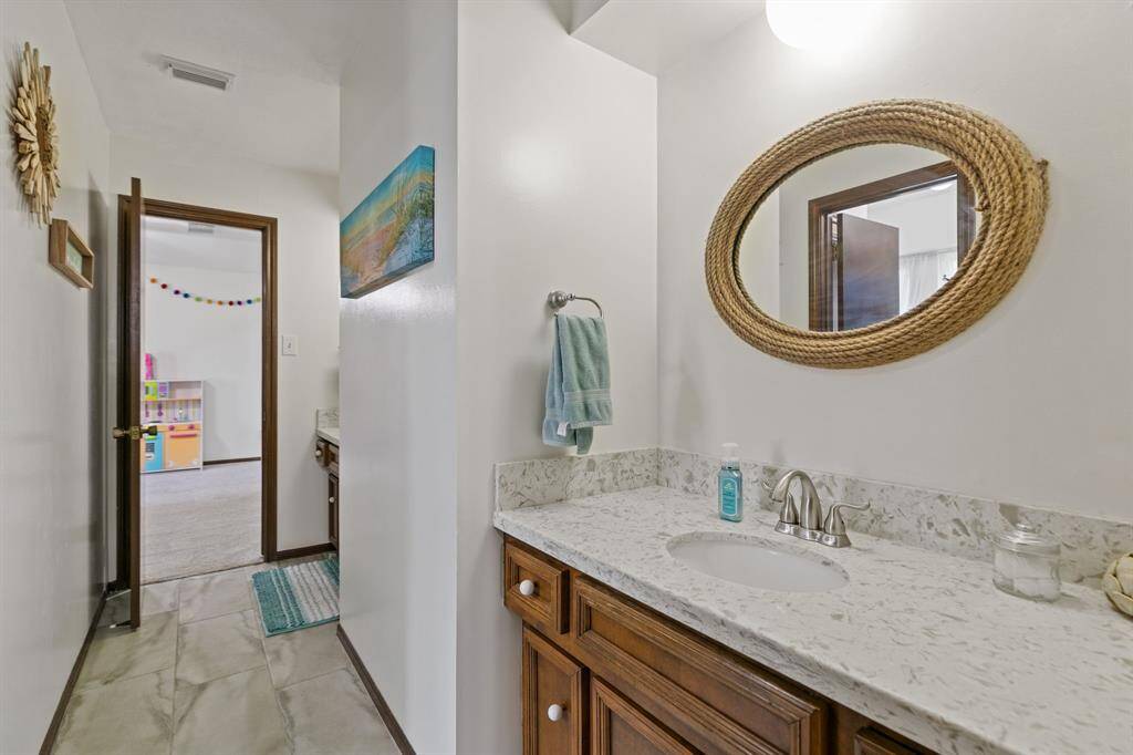 Shared bathroom with updated granite and paint.