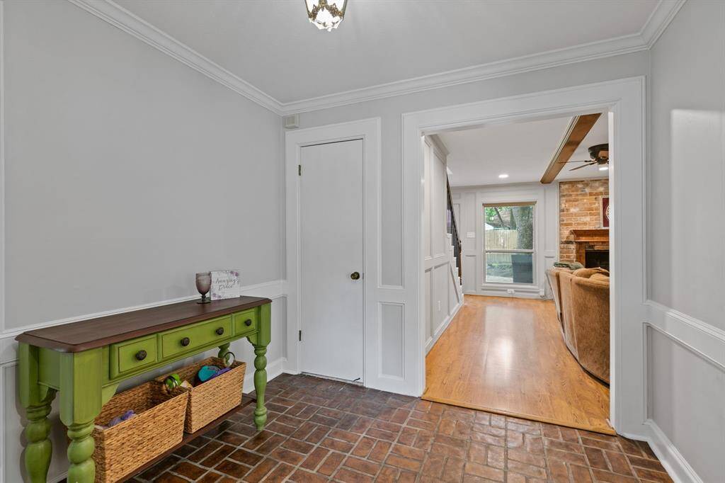 Enter the foyer with fresh paint and distinctive brick look flooring.