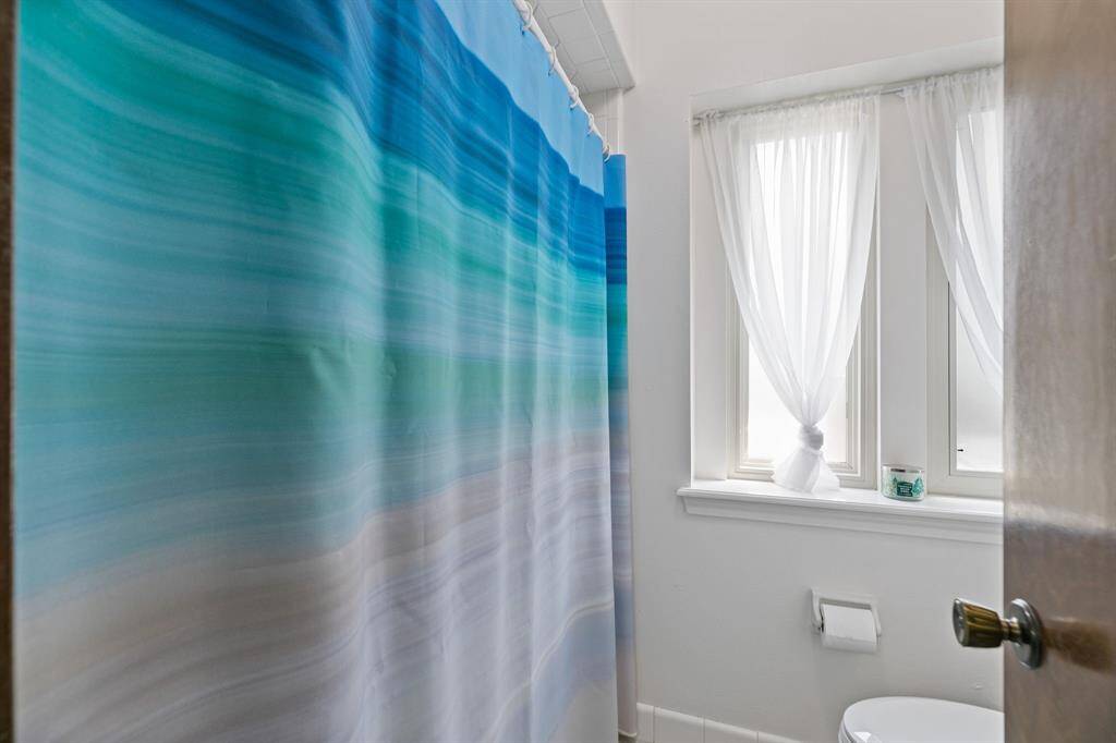 One of two separate showers upstairs.