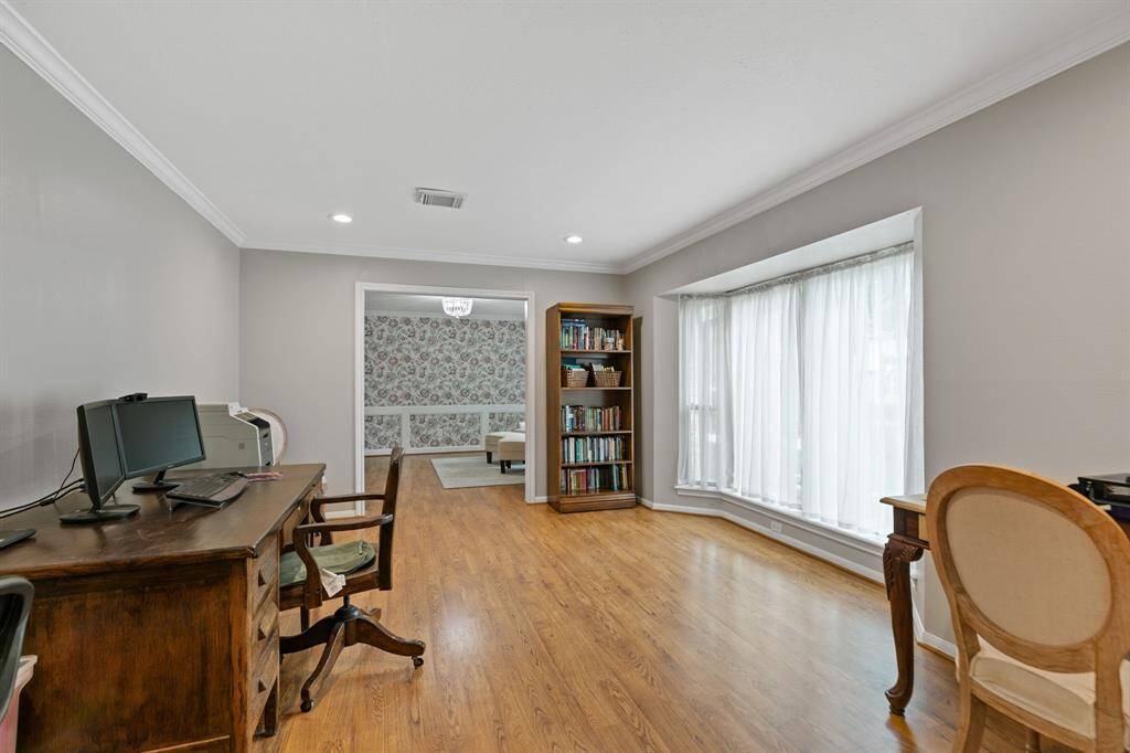 The formal rooms - formal living room is being used as an office space.