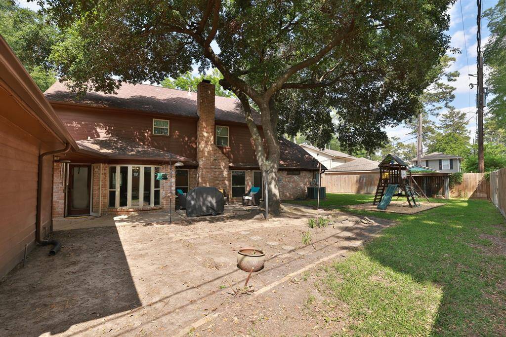 Outdoor space shaded by a graceful oak.