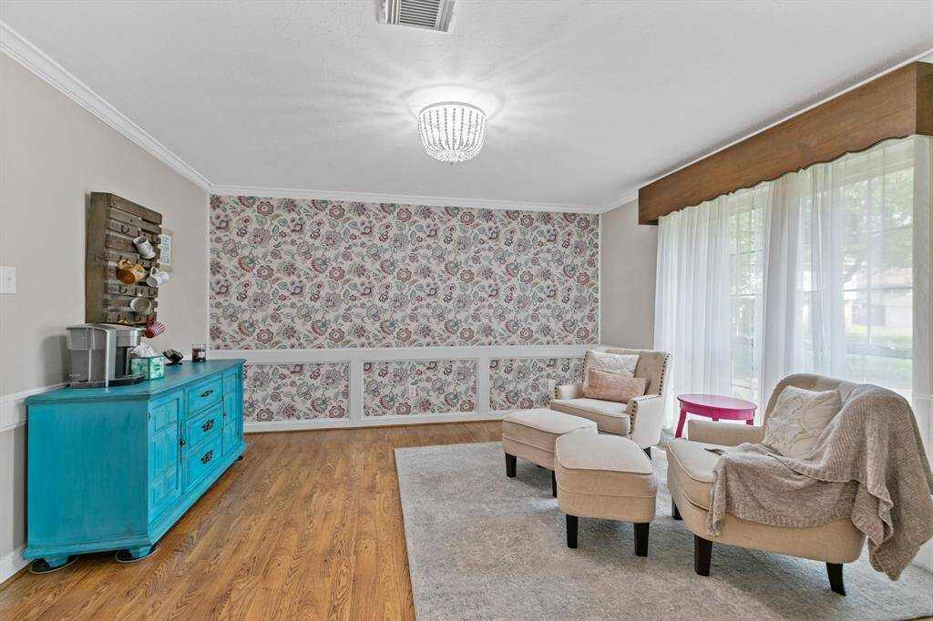 Designer wallpaper accents the formal dining room.