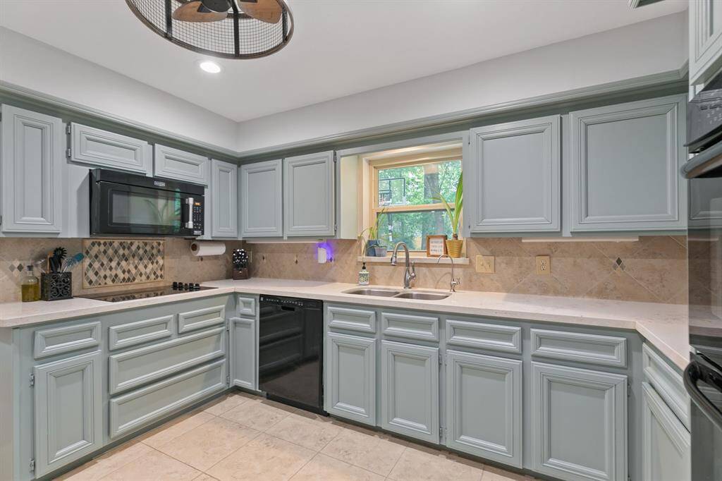 Granite counters and accented backsplash.