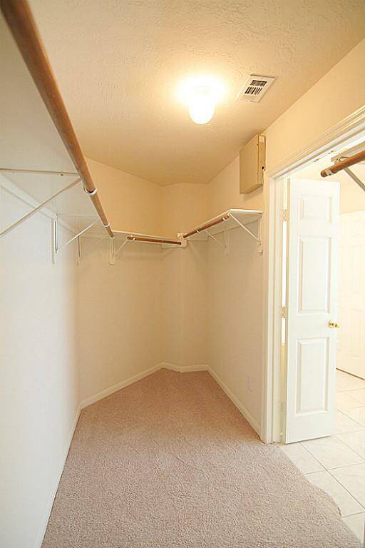 large primary walk-in closet