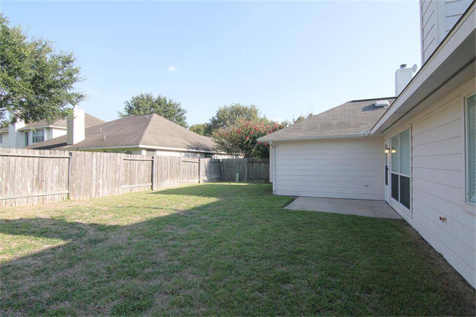 huge backyard with paved patio