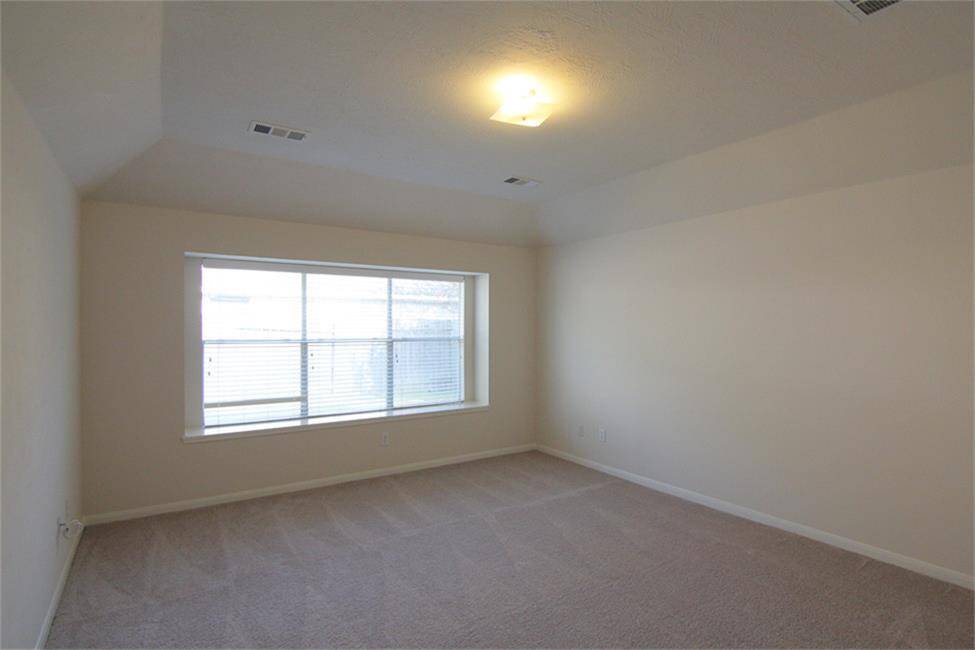 roomy, bright primary bedroom