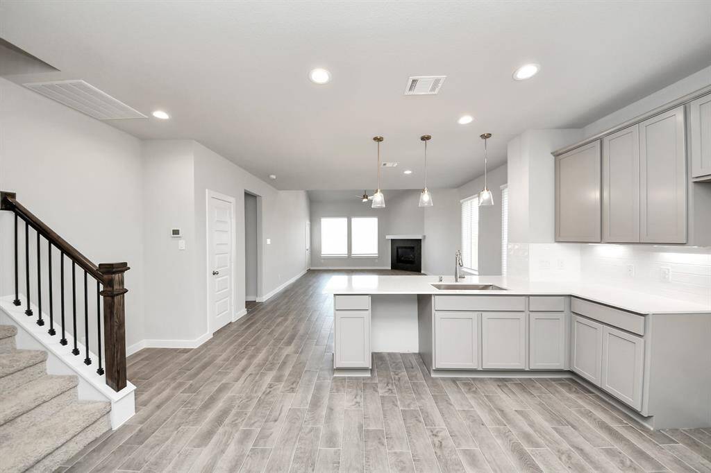 Sample photo of completed home with similar floor plan. As built color and selections may vary.