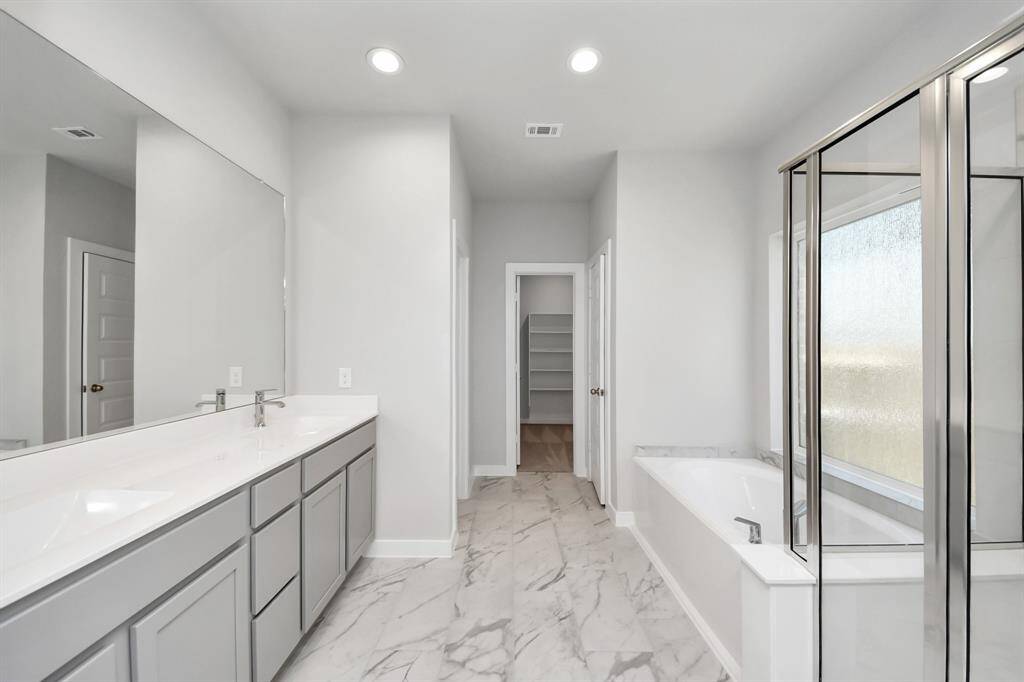 Sample photo of completed home with similar floor plan. As built color and selections may vary.