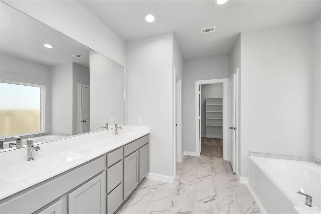Sample photo of completed home with similar floor plan. As built color and selections may vary.