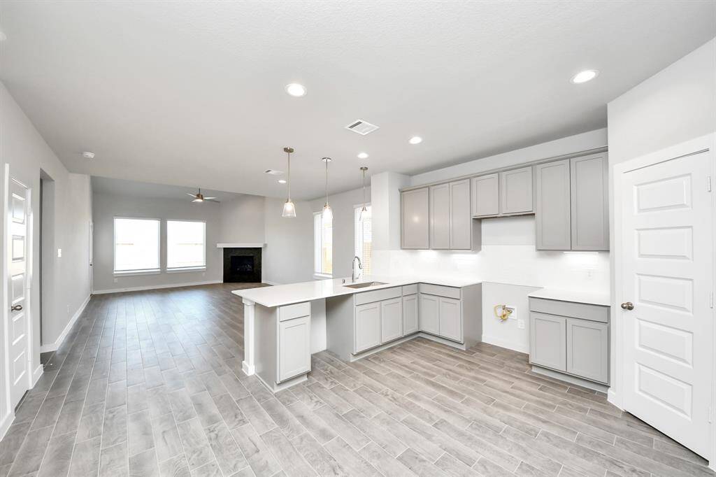 Sample photo of completed home with similar floor plan. As built color and selections may vary.
