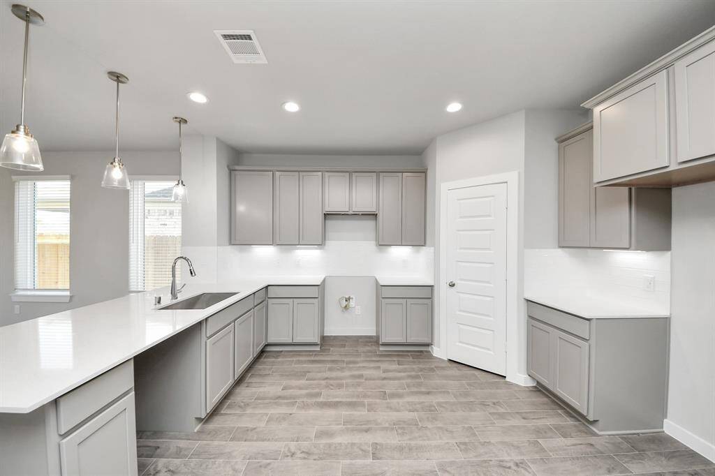Sample photo of completed home with similar floor plan. As built color and selections may vary.