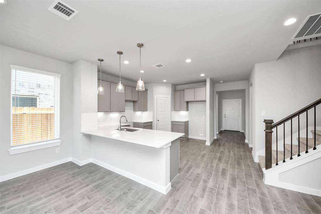 Sample photo of completed home with similar floor plan. As built color and selections may vary.