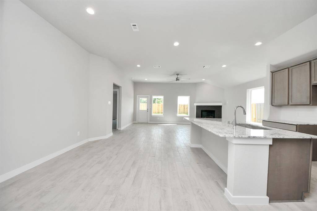 All of this overlooks your expansive family room, creating a perfect space for culinary delights and family gatherings. Sample photo of completed home with similar floor plan. Actual colors and selections may vary.