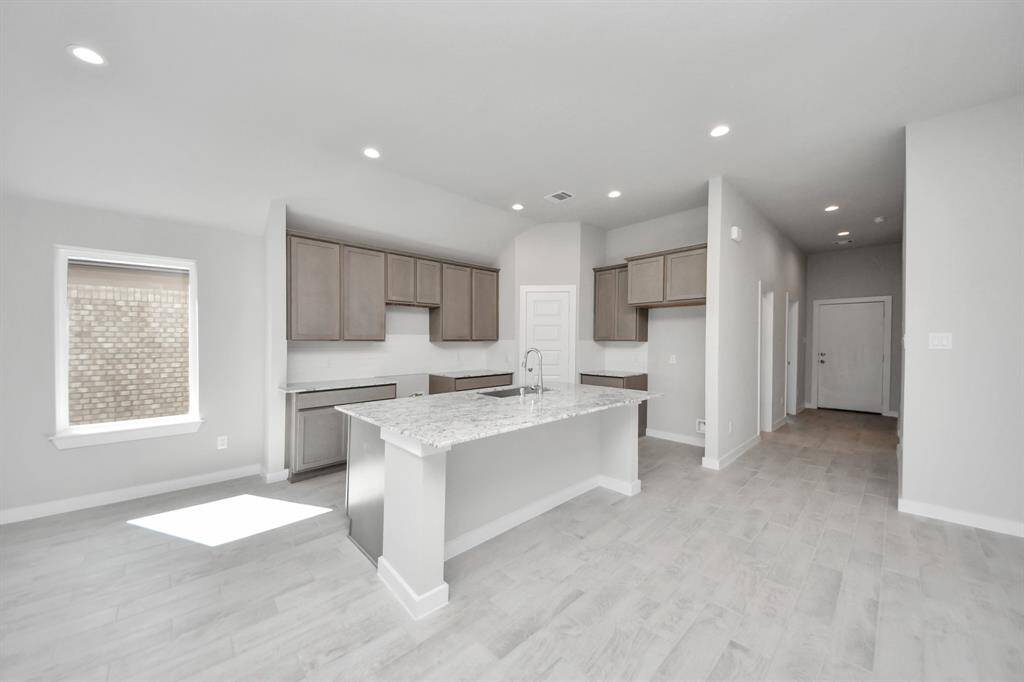 This generously spacious kitchen is a dream realized! Sample photo of completed home with similar floor plan. Actual colors and selections may vary.