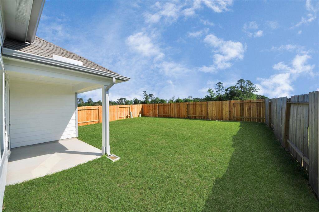 Come and see this spacious backyard with its beautiful covered patio. There is plenty of room for the kids to play and adults to relax. Perfect for your outdoor living space, patio furniture, bbq pit, and so much more. The possibilities are endless! Sample photo of completed home with similar floor plan. Actual colors and selections may vary.