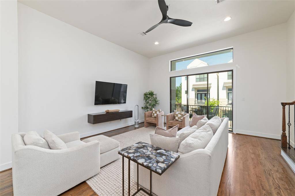 Spacious living room opening to balcony
