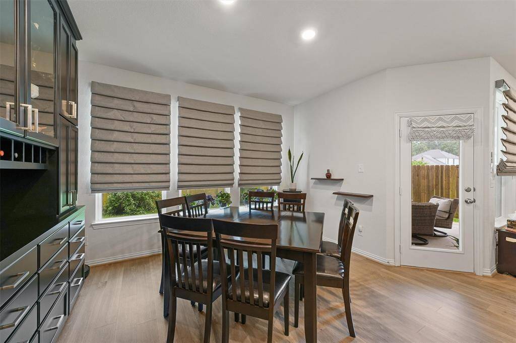 Breakfast room with custom remote blinds, custom cabinets with soft close drawers