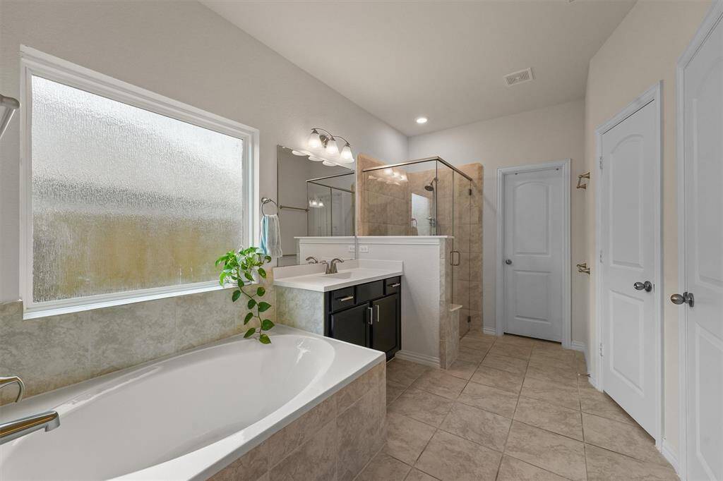 Primary bathroom with separate shower and tub