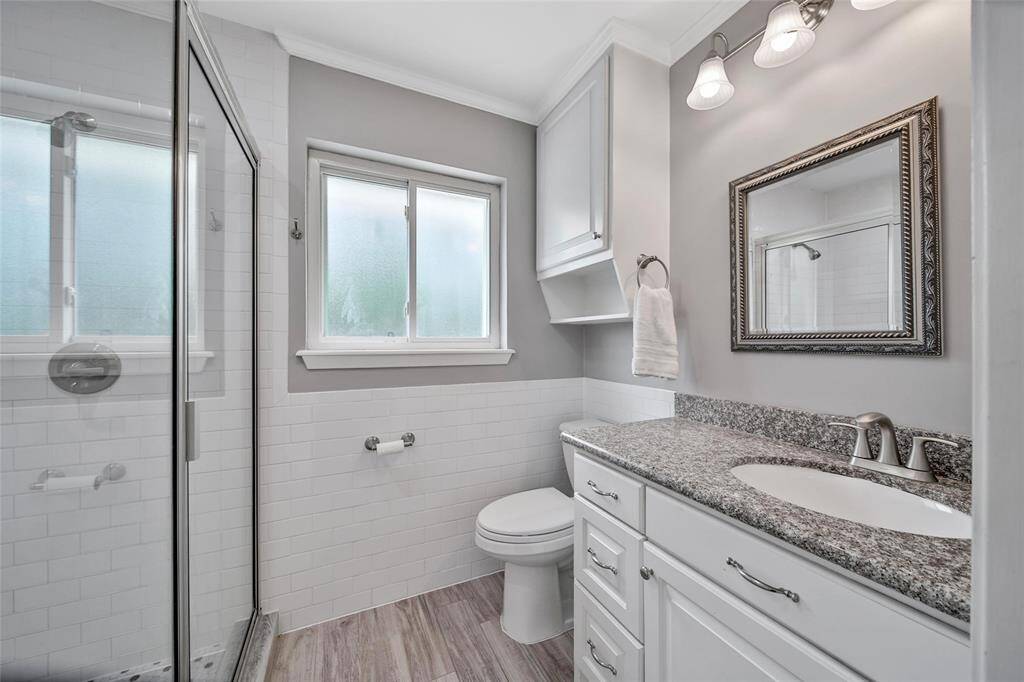 Primary bathroom with glass shower.