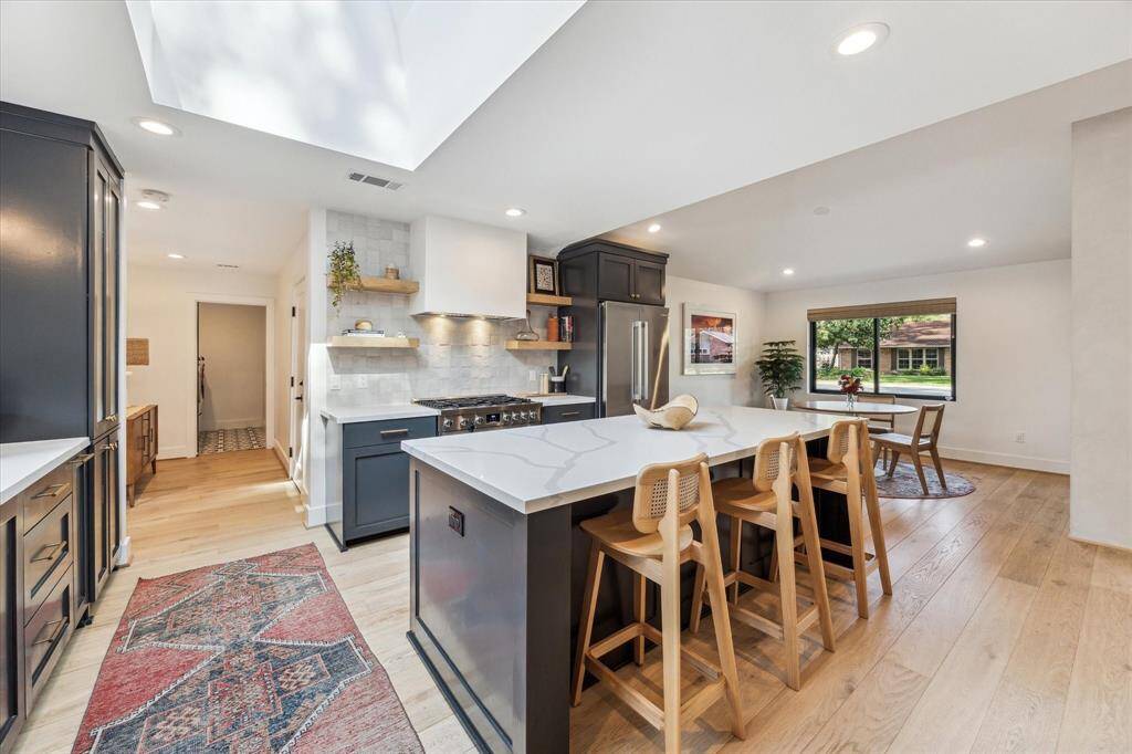 A custom skylight allows natural light to flood into the space.