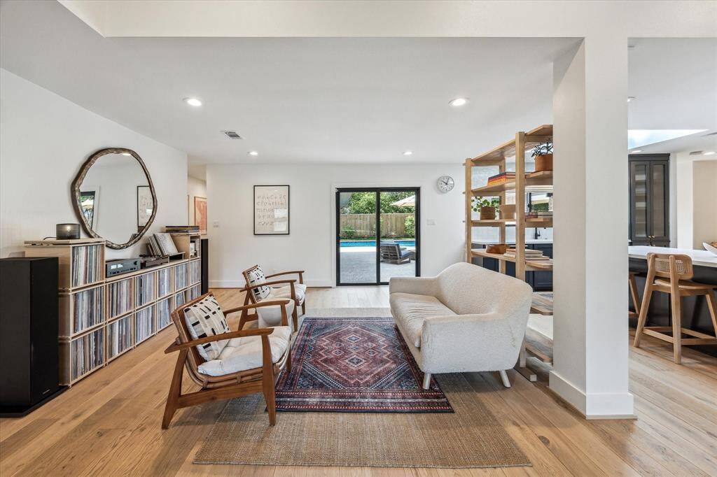 Open and airy living room with direct access to the backyard.