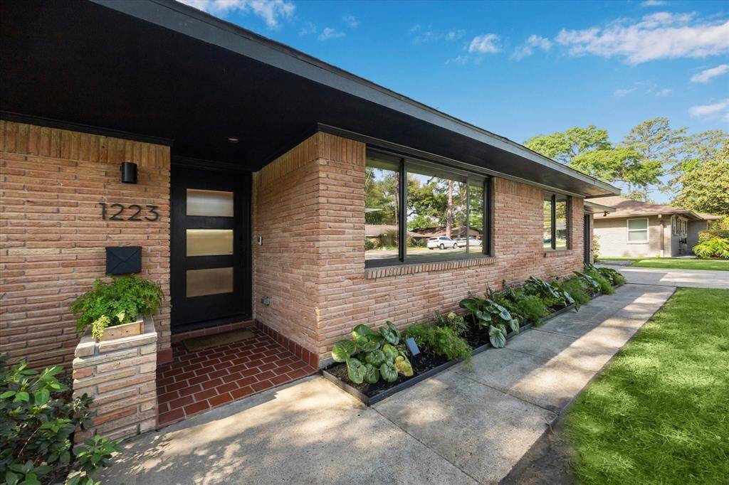 The custom-designed landscaping offers a beautiful first impression for your guests.