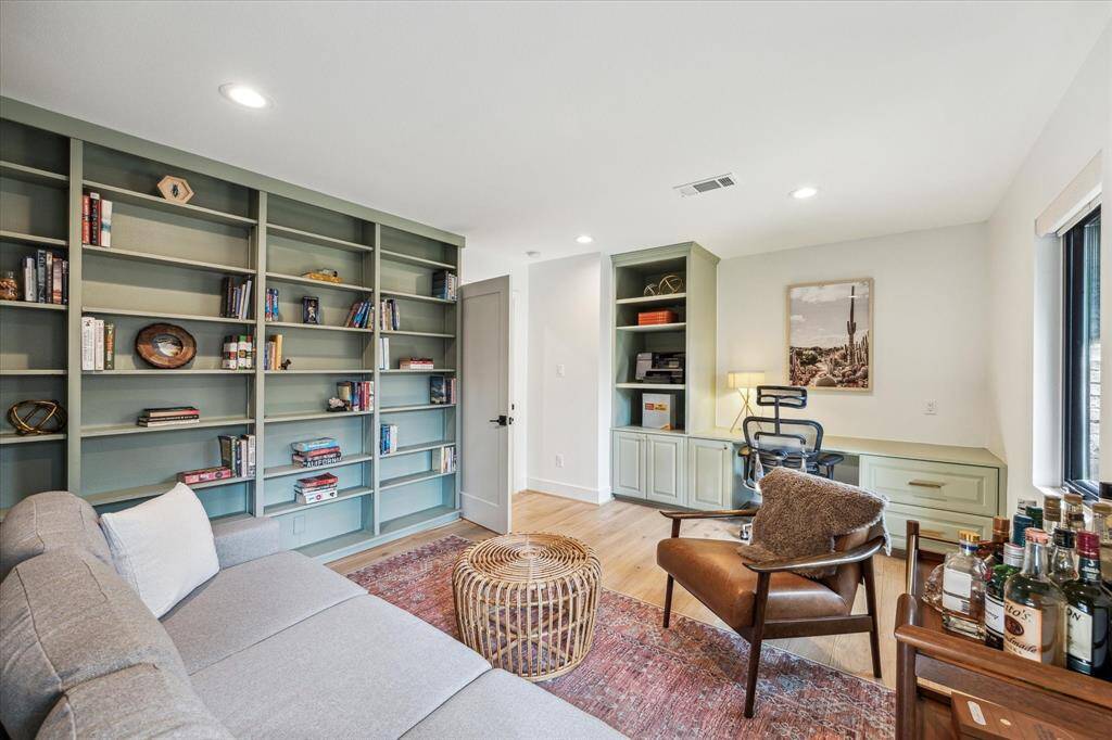 HUGE study with a built-in desk, shelving and cabinets.