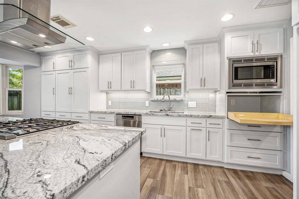 Overview of the kitchen.  Check out the cabinet under the microwave that pulls out to house oversized appliances or use as a coffee bar, there is an electric outlet for all your needs.