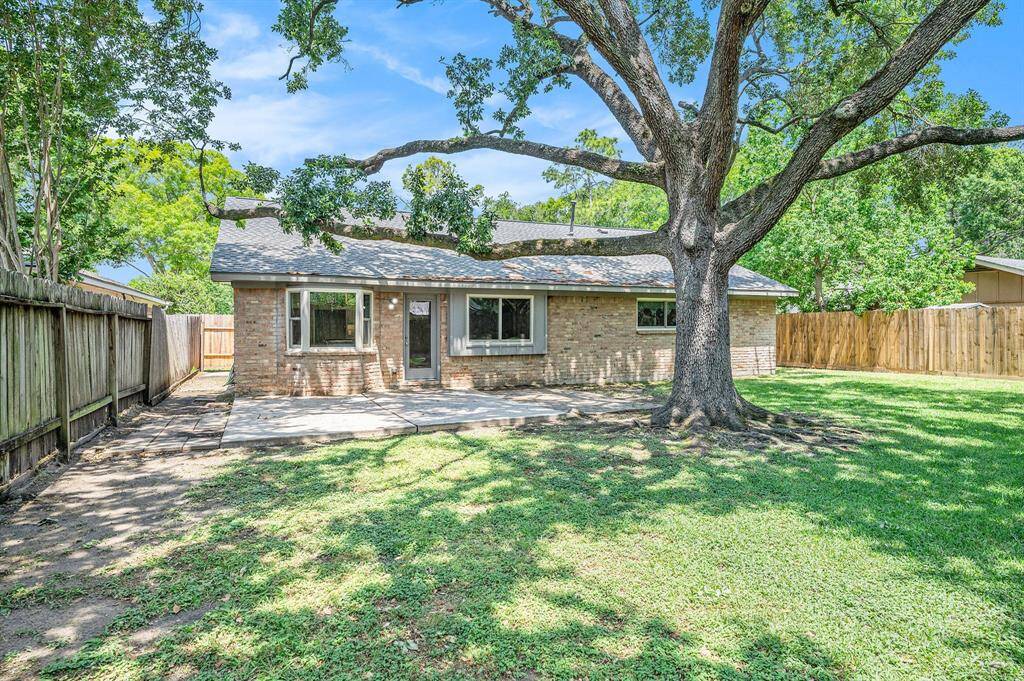 Beautiful shade tree is the backyard that has recently been trimmed. So many option with the patio and all your green space.