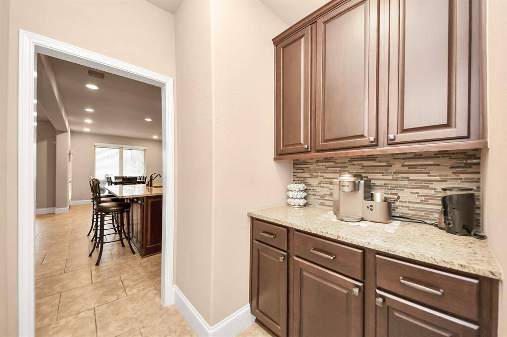 Connecting the Dining room to the kitchen, a Butler's pantry is an ideal space for a cute coffee and beverage bar.