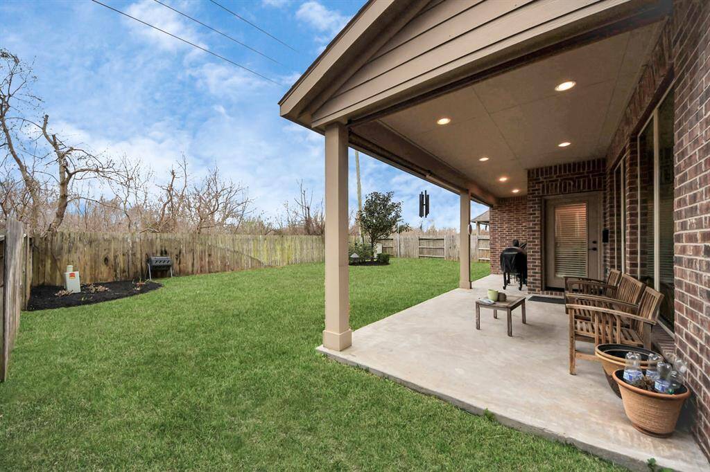 Check out the fully fenced backyard with no back neighbors! Those trees behind the fence can't wait for the spring!