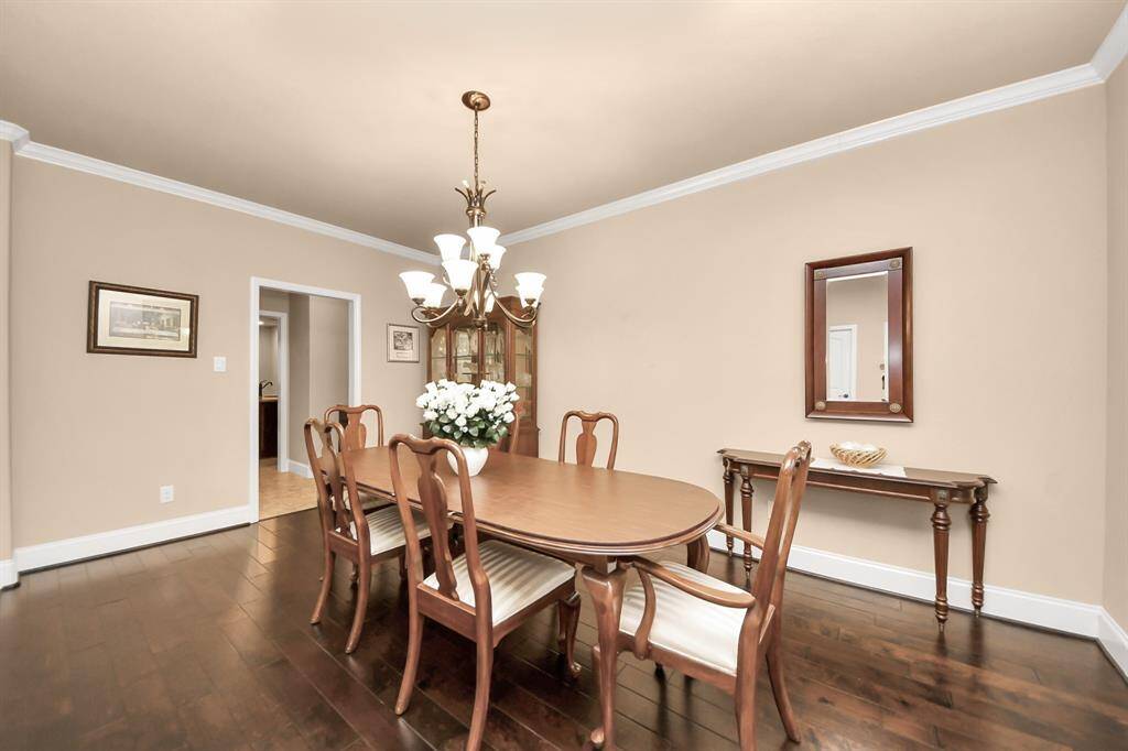 Formal Dining room could easily transform into a nice sitting room with lounge chairs, coffee table and delicious beverages!