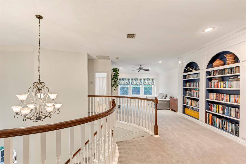 With oversized windows, a built-in bench, and plenty of room to spread out, this game room is ready for movie nights, homework sessions, or laid-back afternoons.
