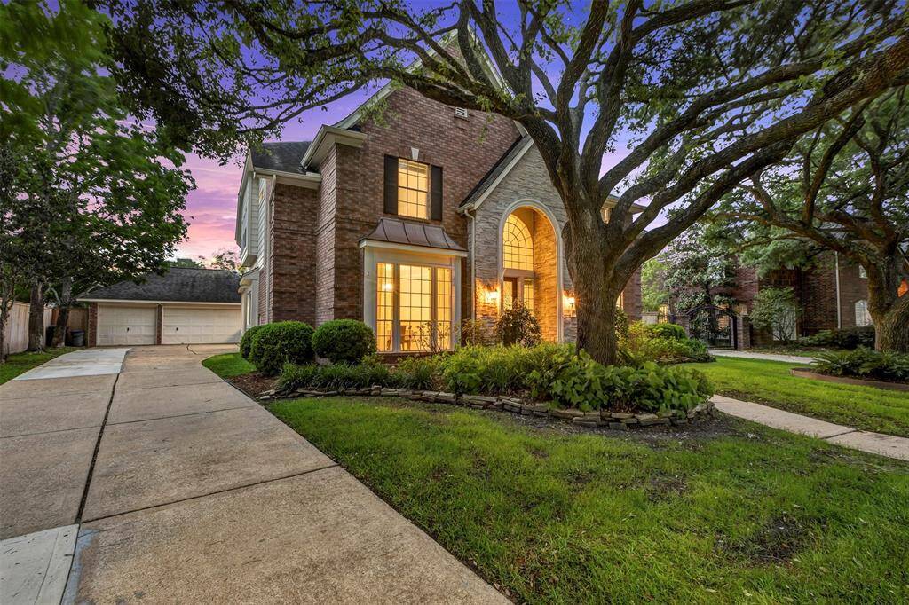 The extra long driveway and three car detached garage provide plenty of space for parking.