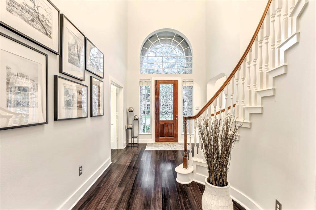 The moment that you walk in, you’re greeted by high ceilings, classic crown molding, and beautiful bamboo floors that instantly make the space feel inviting.