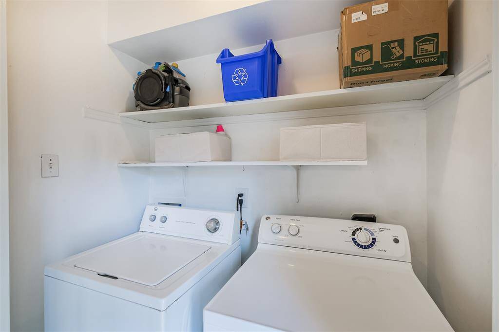 The utility closet accommodates a full size washer and dryer.