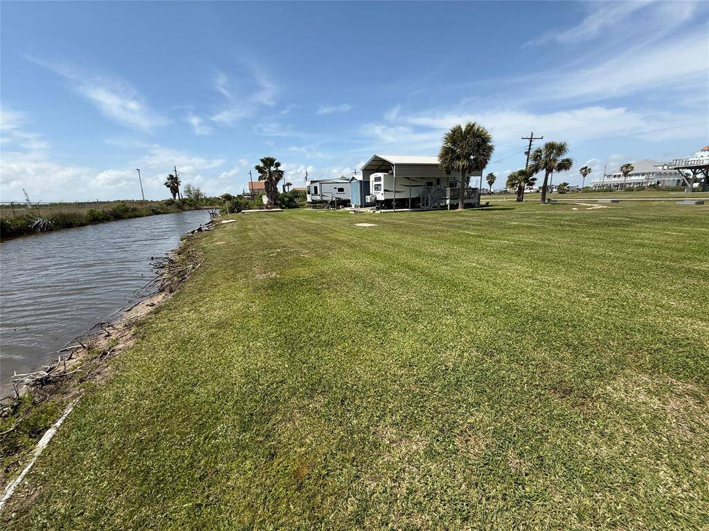 Large, moving water canal lot with views of the Intracoastal canal. Although this canal does not provide access to the main waterway, you still have the amenity of fishing/crabbing from your yard. Boat ramp is only yards from the lot!